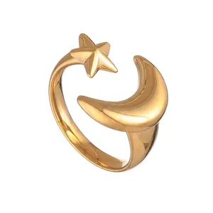 Detailed view of gold plated stainless steel open ring with star and moon charms