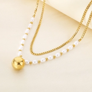 Double-layered gold titanium steel necklace with white pearls and a metallic ball pendant
