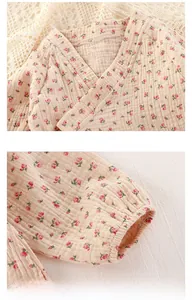 Detail of floral baby bodysuit featuring double-layer cotton gauze and ribbed cuffs