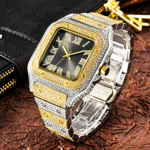 Detail of iced-out square watch showing gold-silver band and stainless steel clasp