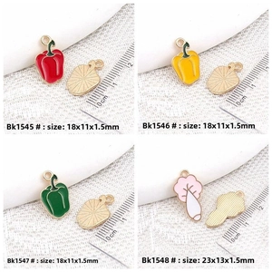 Detail view of colorful alloy pepper pendants with size scale and golden metal back