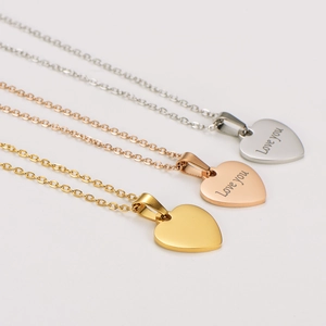 Three 18k gold plated stainless steel heart necklaces in silver, rose gold, and gold