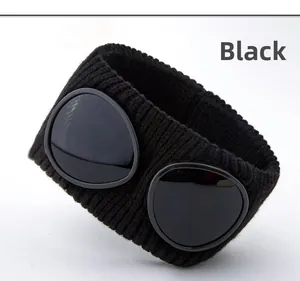 Detail view of black knit headband with stylish goggle lenses and textured acrylic weave