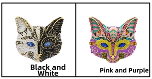 Detail view of retro owl brooches in black-white and colorful enamel with crystals