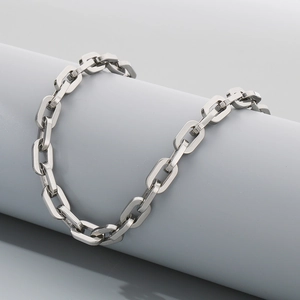 Close-up of a modern 7/9mm silver stainless steel square link chain on a prop