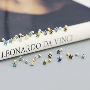 Macro shot of colorful s925 silver flower stud earrings with secure screw backings