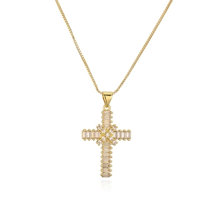 Detail of a gold plated cross pendant necklace featuring shimmering cubic zirconia stones