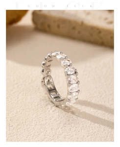 Close-up of a s925 silver eternity ring with sparkling square-cut cubic zirconia stones
