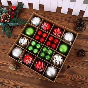 Close-up of colorful Christmas ball set with snowflake patterns in a kraft paper box
