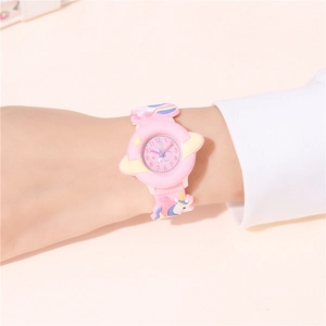 Close-up of kids quartz watch with pink unicorn strap and starry planet dial