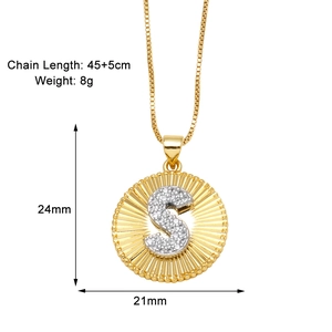 Detail of gold-plated pendant showing dimensions 24x21mm and letter S with cubic zirconia