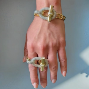 Luxury gold OT buckle jewelry set with pavé cubic zirconia ring and bracelet