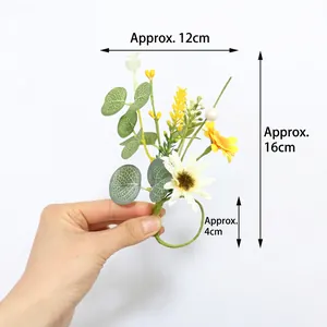 Detail showing artificial daisy and eucalyptus napkin ring with size measurements marked