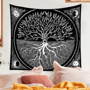 Detail of black and white Tree of Life tapestry with sun and moon celestial symbols