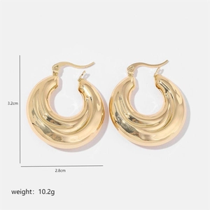 Detailed view of gold chunky C-hoop earrings with 3.2cm height and 2.8cm width dimensions
