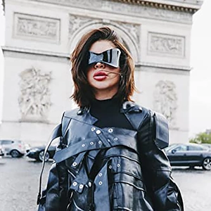 Chic Y2K rimless sunglasses styled with a leather jacket in an urban Paris street setting