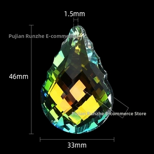 Detail view of large teardrop crystal pendant with AB coating showing rainbow reflections