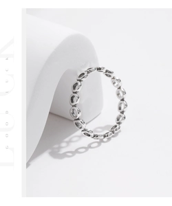 Detail of s925 silver irregular oval open rings with a vertical Good Luck text design