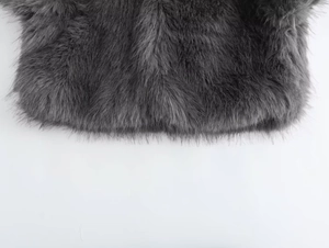 Close-up of high-density grey faux fur texture with long plush fibers and soft luster