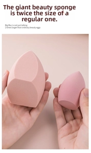 Detail of giant pink beauty blender sponge next to standard size for scale comparison