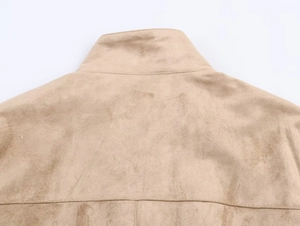 Detailed close-up showing the suede texture and collar stitching of the khaki jacket