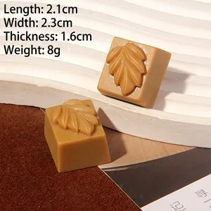Detailed macro view of chocolate-themed resin charms showing 2.1cm size and leaf texture