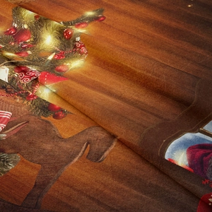 Detailed view of soft flannel texture with vintage Christmas tree and reindeer prints