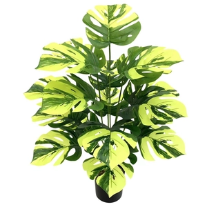Artificial Monstera Deliciosa plant in black pot with yellow-green variegated leaves