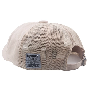 Detail of breathable mesh splicing and adjustable metal buckle on beige octagonal cap