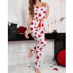 Detail of ribbed knit loungewear set with red heart prints and silk bow decoration