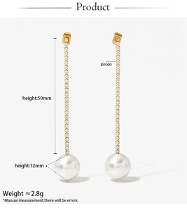 Detail of long drop earrings featuring zircon studs and a 12mm round pearl pendant