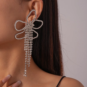Luxurious long tassel drop earrings with sparkling rhinestone flower and bow design