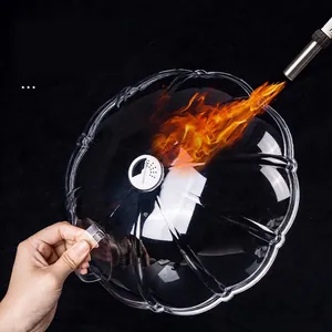 Heat-resistant microwave food cover with vent showing direct fire durability test