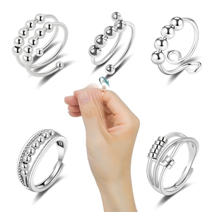 Set of six stainless steel anxiety relief spinner rings with rotating beads for women