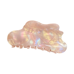 Iridescent pink cloud-shaped hair claw clip in acetate finish on white background