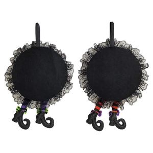 Detail of Halloween witch leg hanging ornaments with black lace and striped stockings