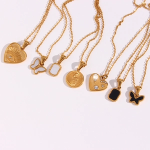 Set of seven gold-plated stainless steel necklaces with butterfly and evil eye charms