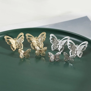 Elegant hollow butterfly earrings in gold and silver finish with fine glitter details