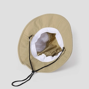 Detail of khaki hiking hat interior showing white sweatband and 100% nylon material