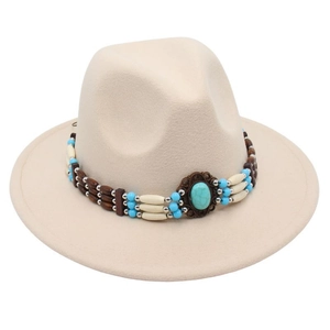 Detail of turquoise beads and vintage stone on beige wool fedora hat with ethnic band
