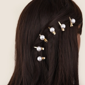 Classic golden pearl duckbill hair clips set for women displayed on model side profile