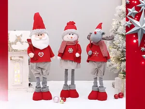 Three plush Christmas dolls featuring Santa, Snowman and Reindeer in red knit outfits