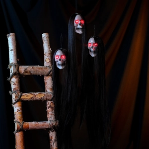 Three hanging Halloween ghosts with glowing red eyes and long black hair decor
