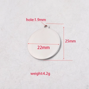 Detailed view of 22mm mirror polished stainless steel blank disc with 1.9mm hole size