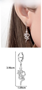 Silver S-shaped snake drop earring with snowflake charms and rhinestones detail