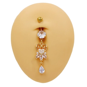 Detailed view of gold hollow heart belly ring with marquise zircon on a silicone model