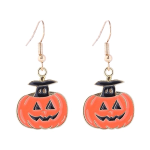 Detail view of Halloween pumpkin earrings with wizard hats and orange enamel finish