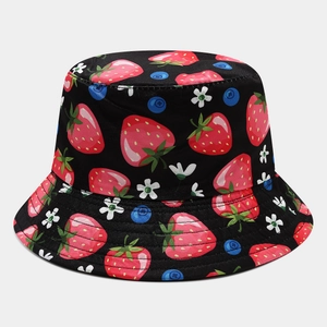 Detailed close-up of fruit print bucket hat featuring strawberries and blueberries