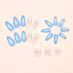 Detail of silver starburst press-on nails with blue and pink French tips and rhinestones