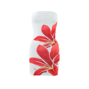 Detailed view of the vibrant red lily print on a white strapless mini bodycon dress
